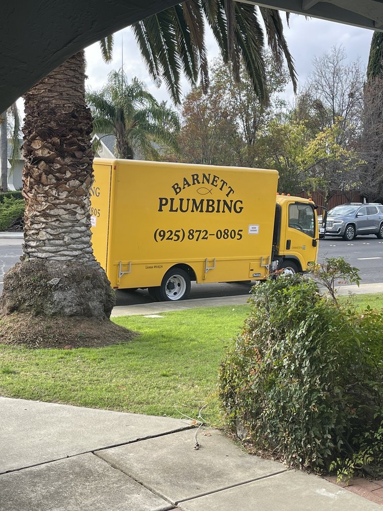 Barnett Plumbing truck parked for a repair job