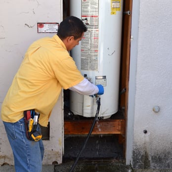 Barnett Plumbing technician flushes a 50 gallon water heater in Fremont